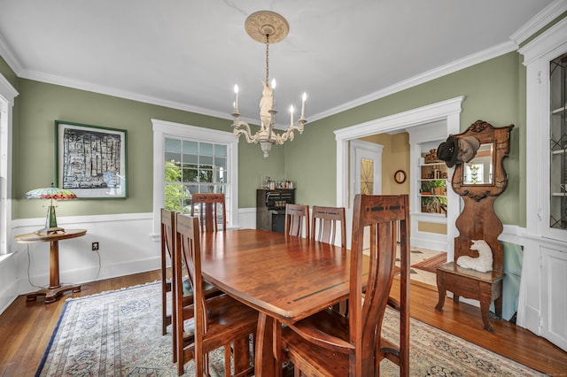 95 Parsons St, Wallingford, CT 06492 - dining area featuring ornamental molding, a chandelier, wood finished floors, and wainscoting