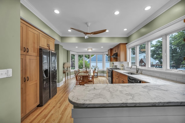 95 Parsons St, Wallingford, CT 06492 - kitchen with black appliances, crown molding, recessed lighting, light stone countertops, and light wood finished floors