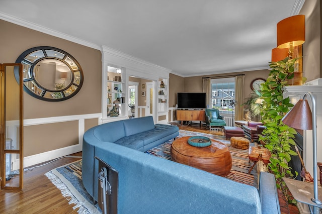 95 Parsons St, Wallingford, CT 06492 - living room with wood finished floors, ornamental molding, and built in shelves