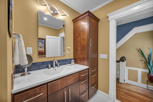 95 Parsons St, Wallingford, CT 06492 - bathroom featuring crown molding, vanity, and wood finished floors