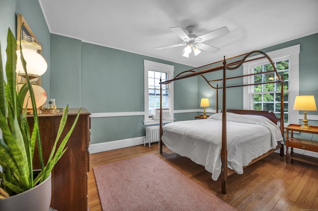 95 Parsons St, Wallingford, CT 06492 - bedroom featuring radiator heating unit, hardwood / wood-style floors, crown molding, and ceiling fan