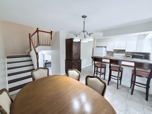 333 Vincellette St Unit 114, Bridgeport, CT 06606 - dining space featuring stairs and light tile patterned floors