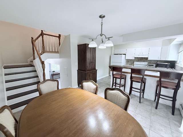 333 Vincellette St Unit 114, Bridgeport, CT 06606 - dining room with light tile patterned flooring and stairs