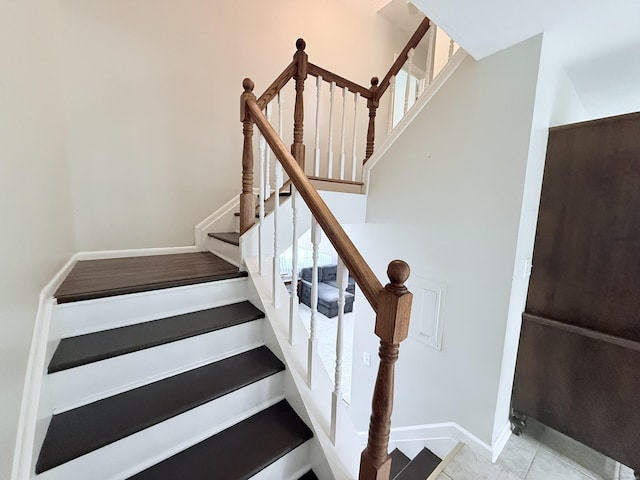 333 Vincellette St Unit 114, Bridgeport, CT 06606 - staircase with baseboards and tile patterned floors