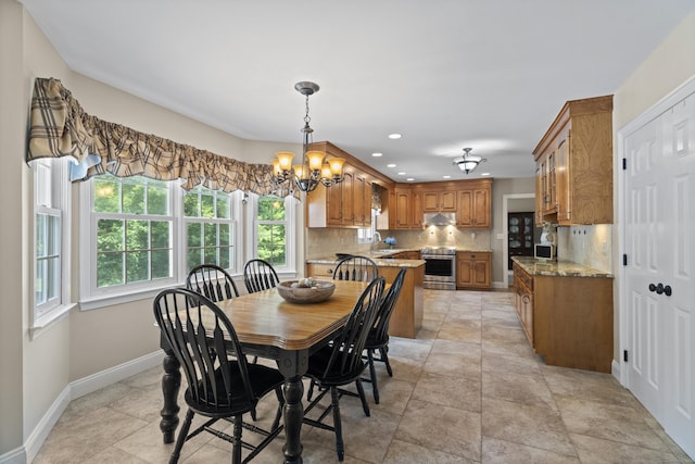 8 Marie Ln, Wallingford, CT 06492 - dining area with plenty of natural light, a chandelier, recessed lighting, and stone finish floors