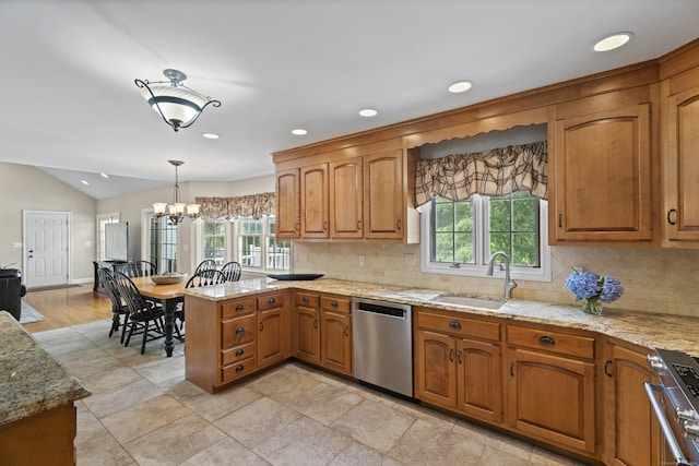 8 Marie Ln, Wallingford, CT 06492 - kitchen with appliances with stainless steel finishes, tasteful backsplash, a peninsula, brown cabinetry, and vaulted ceiling