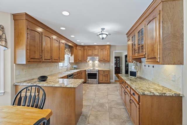 8 Marie Ln, Wallingford, CT 06492 - kitchen featuring stainless steel appliances, brown cabinets, glass insert cabinets, under cabinet range hood, and light stone counters