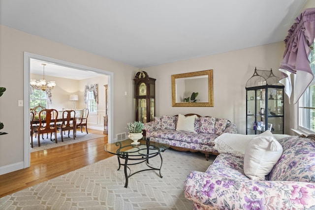 8 Marie Ln, Wallingford, CT 06492 - living room with wood finished floors and a chandelier