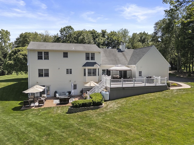 8 Marie Ln, Wallingford, CT 06492 - back of property featuring a patio, a deck, an outdoor living space, a lawn, and a chimney