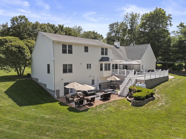 8 Marie Ln, Wallingford, CT 06492 - back of property with an outdoor living space, a patio area, a deck, a lawn, and a chimney