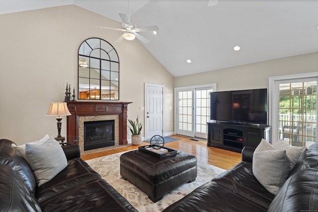 8 Marie Ln, Wallingford, CT 06492 - living area with a high end fireplace, ceiling fan, healthy amount of natural light, high vaulted ceiling, and light wood-style floors