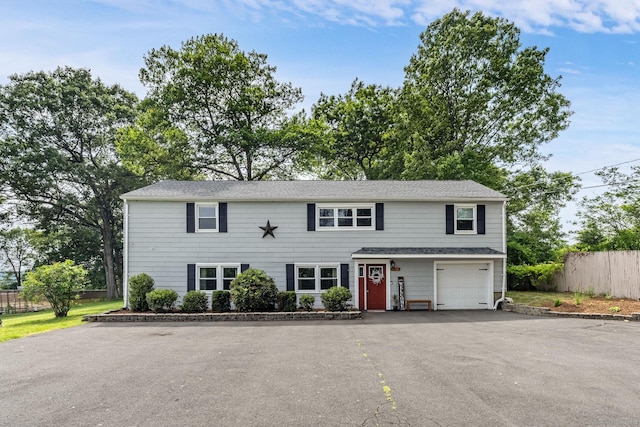 1376 W St, Southington, CT 06489 - view of front of house featuring driveway and a garage