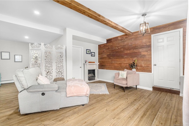 1376 W St, Southington, CT 06489 - living room with wood walls, light wood finished floors, beam ceiling, a chandelier, and baseboard heating