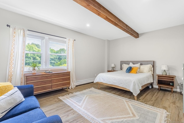 1376 W St, Southington, CT 06489 - bedroom featuring a baseboard heating unit, wood finished floors, and beam ceiling