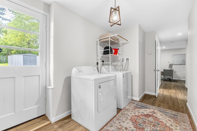 1376 W St, Southington, CT 06489 - laundry room featuring washing machine and clothes dryer, light wood-type flooring, and an office area