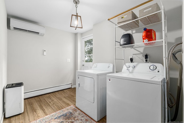 1376 W St, Southington, CT 06489 - laundry area featuring a wall unit AC, separate washer and dryer, a baseboard heating unit, and light wood-style floors