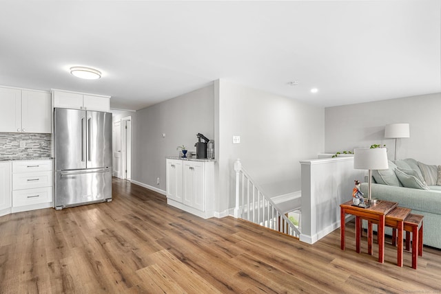 1376 W St, Southington, CT 06489 - living room with light wood finished floors and recessed lighting