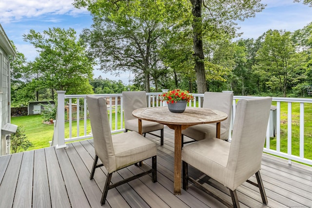 1376 W St, Southington, CT 06489 - wooden deck with outdoor dining space and a lawn