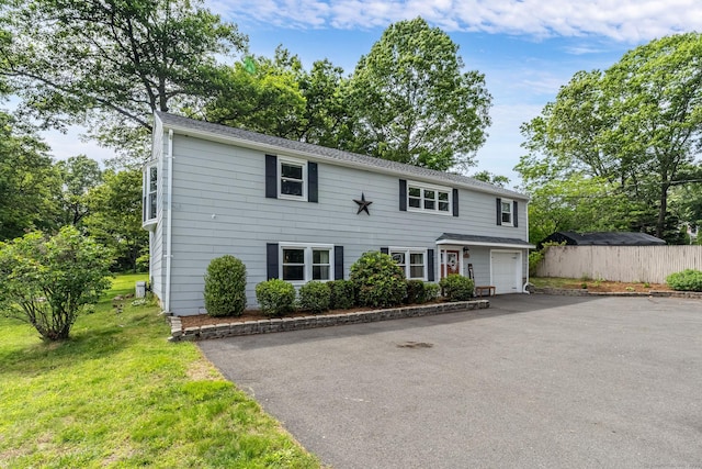 1376 W St, Southington, CT 06489 - view of front facade with driveway and an attached garage