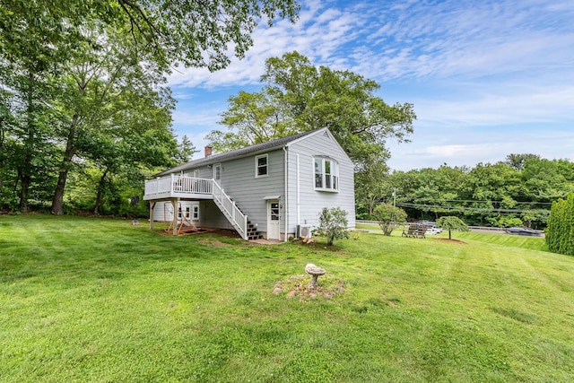 1376 W St, Southington, CT 06489 - back of house with stairs, a chimney, a wooden deck, and a lawn