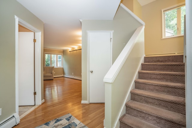 2 Talcott Gln Unit F, Farmington, CT 06032 - stairs with a baseboard radiator, wood finished floors, and a baseboard heating unit