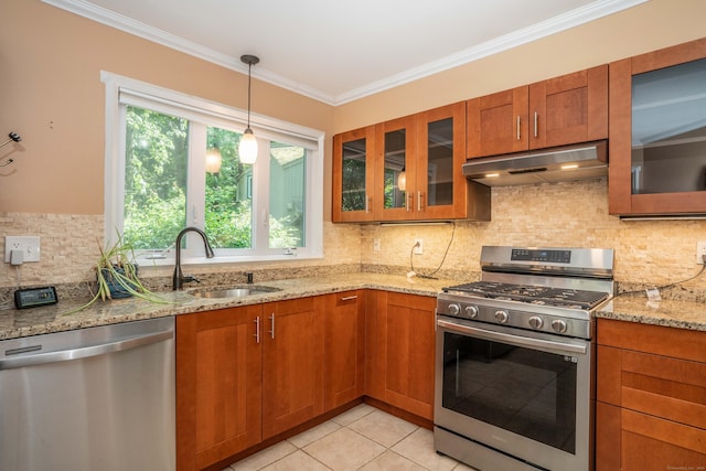 2 Talcott Gln Unit F, Farmington, CT 06032 - kitchen featuring stainless steel appliances, under cabinet range hood, brown cabinetry, and crown molding