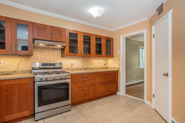 2 Talcott Gln Unit F, Farmington, CT 06032 - kitchen with stainless steel range with gas stovetop, under cabinet range hood, a baseboard radiator, brown cabinetry, and glass insert cabinets