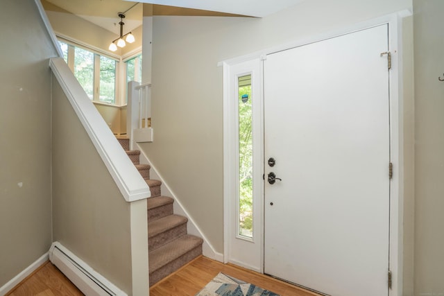 2 Talcott Gln Unit F, Farmington, CT 06032 - foyer entrance with a baseboard heating unit, light wood-style flooring, plenty of natural light, and stairway