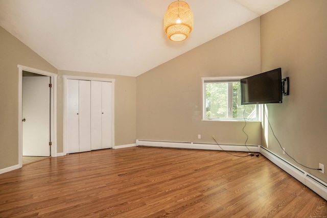 2 Talcott Gln Unit F, Farmington, CT 06032 - unfurnished bedroom featuring lofted ceiling, light wood finished floors, a baseboard radiator, and a closet