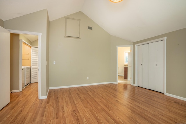 2 Talcott Gln Unit F, Farmington, CT 06032 - unfurnished bedroom featuring lofted ceiling, light wood-type flooring, a baseboard heating unit, washer / clothes dryer, and a closet