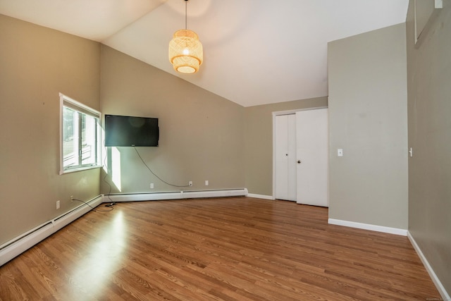 2 Talcott Gln Unit F, Farmington, CT 06032 - spare room with wood finished floors, vaulted ceiling, and baseboard heating