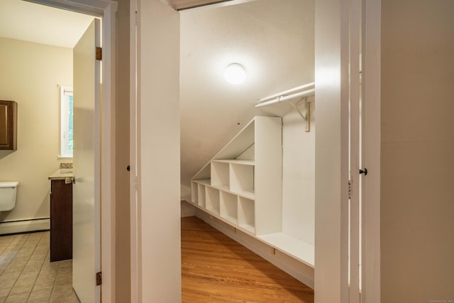 2 Talcott Gln Unit F, Farmington, CT 06032 - spacious closet featuring a baseboard heating unit and light wood finished floors