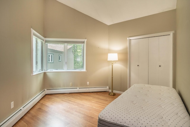 2 Talcott Gln Unit F, Farmington, CT 06032 - bedroom with a baseboard heating unit, wood finished floors, lofted ceiling, and a closet