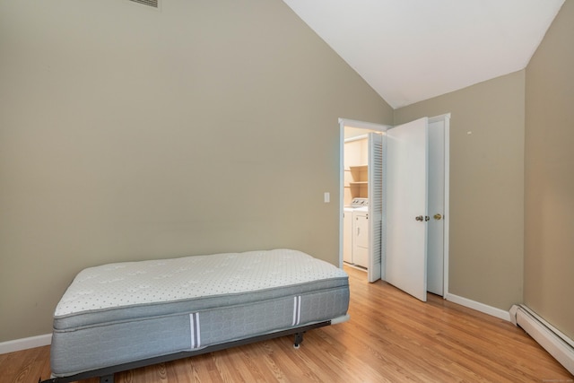 2 Talcott Gln Unit F, Farmington, CT 06032 - bedroom featuring a baseboard radiator, light wood-type flooring, washer / clothes dryer, and lofted ceiling