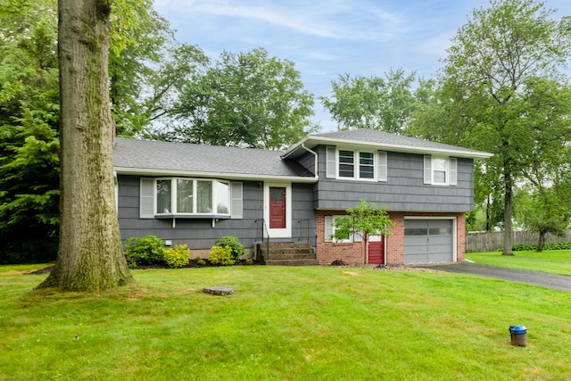 38 Evelyn Rd, Bristol, CT 06010 - split level home with driveway, a garage, a shingled roof, and brick siding