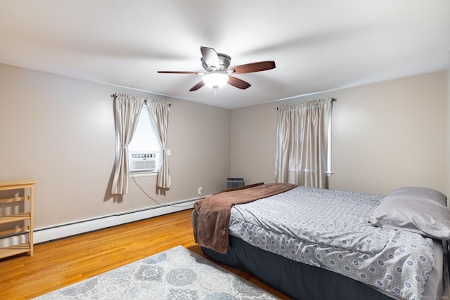 38 Evelyn Rd, Bristol, CT 06010 - bedroom featuring wood finished floors, a baseboard radiator, and a ceiling fan