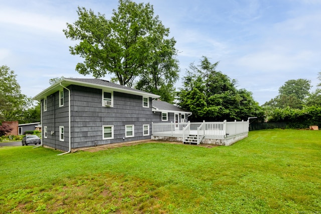 38 Evelyn Rd, Bristol, CT 06010 - rear view of house with a lawn and a wooden deck