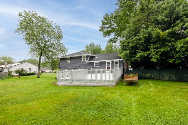 38 Evelyn Rd, Bristol, CT 06010 - back of property with a wooden deck and a shingled roof