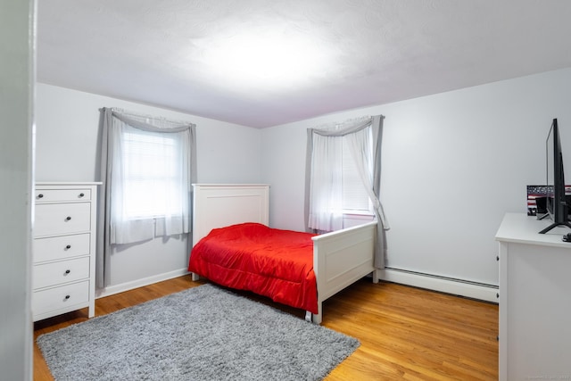 38 Evelyn Rd, Bristol, CT 06010 - bedroom featuring a baseboard radiator and light wood-type flooring
