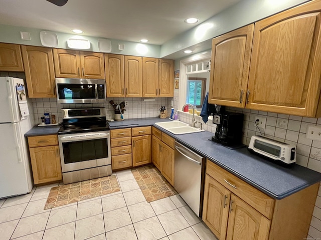 39 Mariner Cir, Trumbull, CT 06611 - kitchen featuring appliances with stainless steel finishes, dark countertops, tasteful backsplash, and recessed lighting