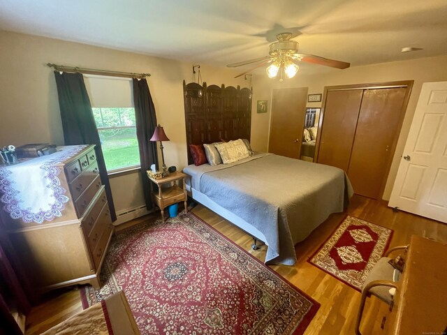 39 Mariner Cir, Trumbull, CT 06611 - bedroom featuring wood finished floors, ceiling fan, a closet, and baseboard heating
