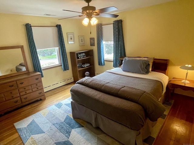 39 Mariner Cir, Trumbull, CT 06611 - bedroom featuring a baseboard radiator, wood finished floors, and ceiling fan