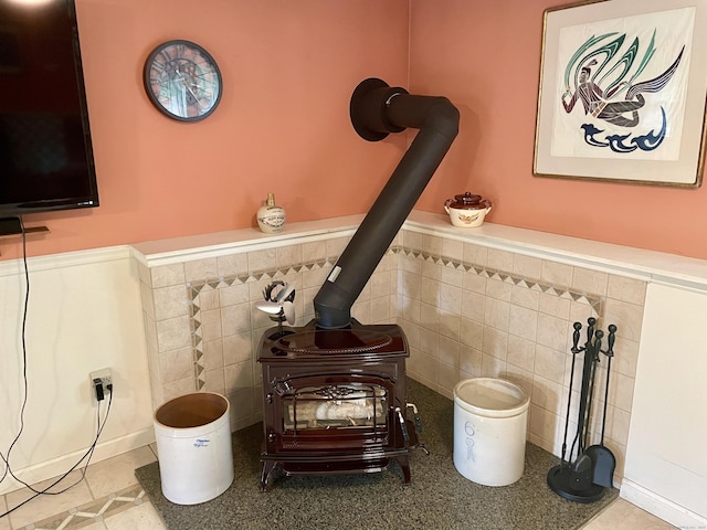 39 Mariner Cir, Trumbull, CT 06611 - detailed view of a wood stove, a wainscoted wall, and tile walls