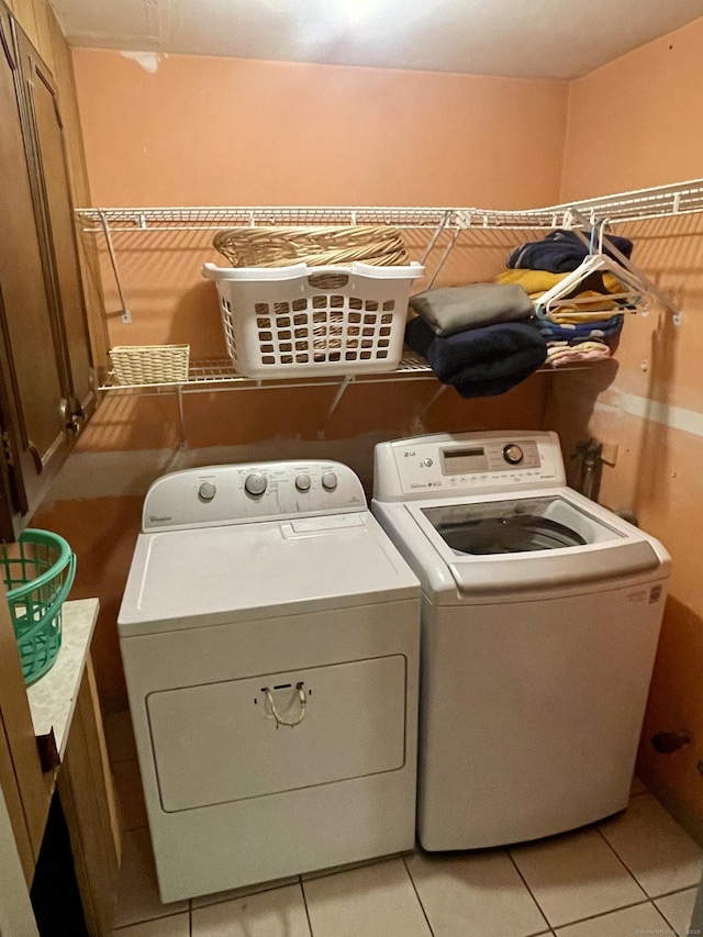 39 Mariner Cir, Trumbull, CT 06611 - laundry area with separate washer and dryer and light tile patterned floors