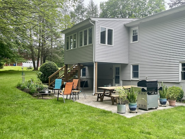 39 Mariner Cir, Trumbull, CT 06611 - back of property with stairs, a patio, and a lawn