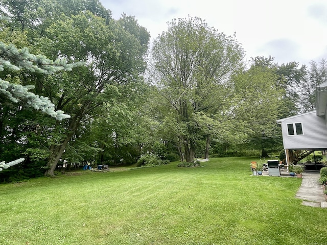 39 Mariner Cir, Trumbull, CT 06611 - view of grassy yard featuring stairway and view of wooded area