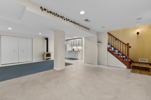 12 Haas Rd, Somers, CT 06071 - unfurnished living room featuring stairs, recessed lighting, and a wood stove