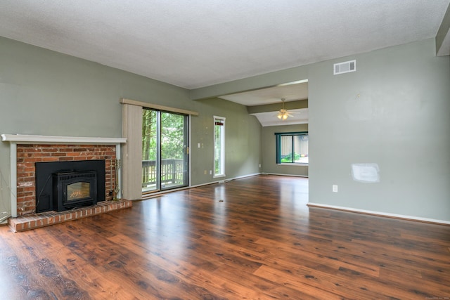 65 Heritage Vlg Unit B, Southbury, CT 06488 - unfurnished living room featuring a ceiling fan, wood finished floors, and a brick fireplace