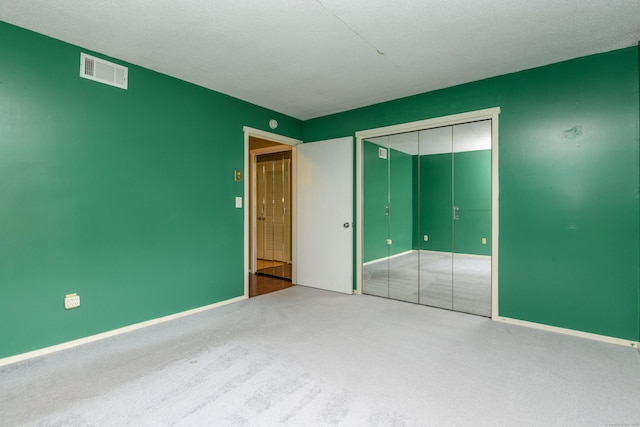 65 Heritage Vlg Unit B, Southbury, CT 06488 - unfurnished bedroom featuring carpet floors and a closet