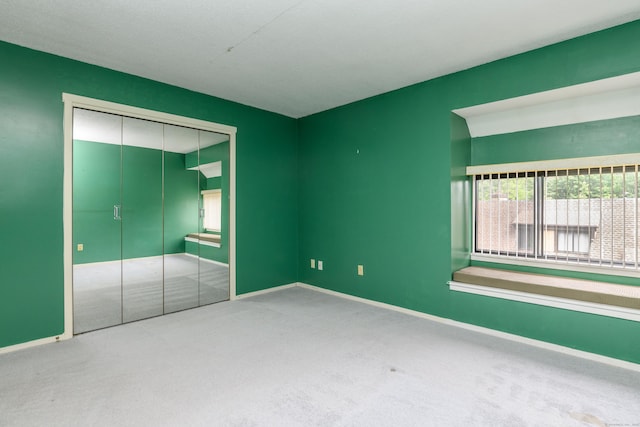 65 Heritage Vlg Unit B, Southbury, CT 06488 - unfurnished bedroom featuring carpet and a closet